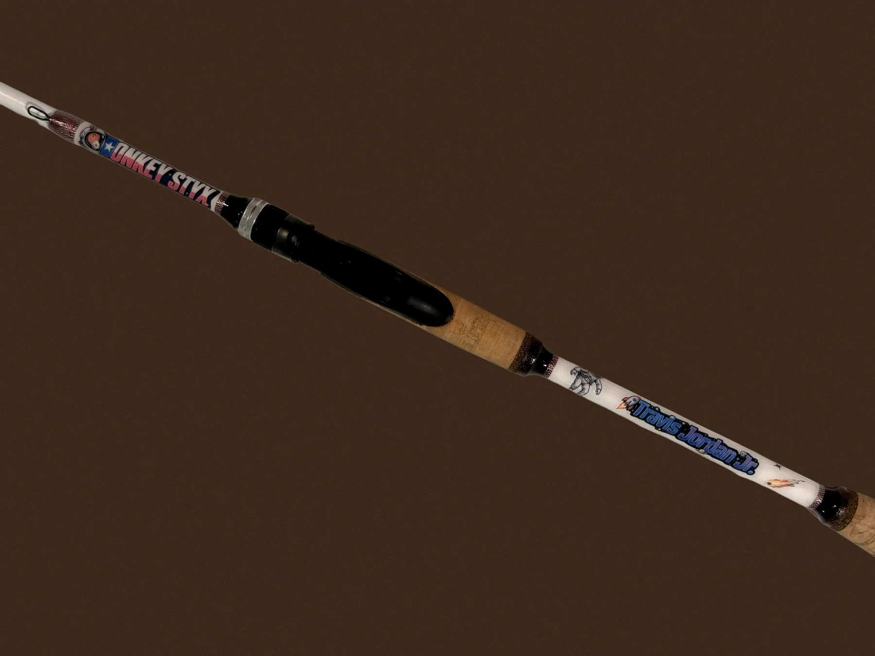 A finished custom Donkey Styx rod, Travis Jordan Jr. name wrap