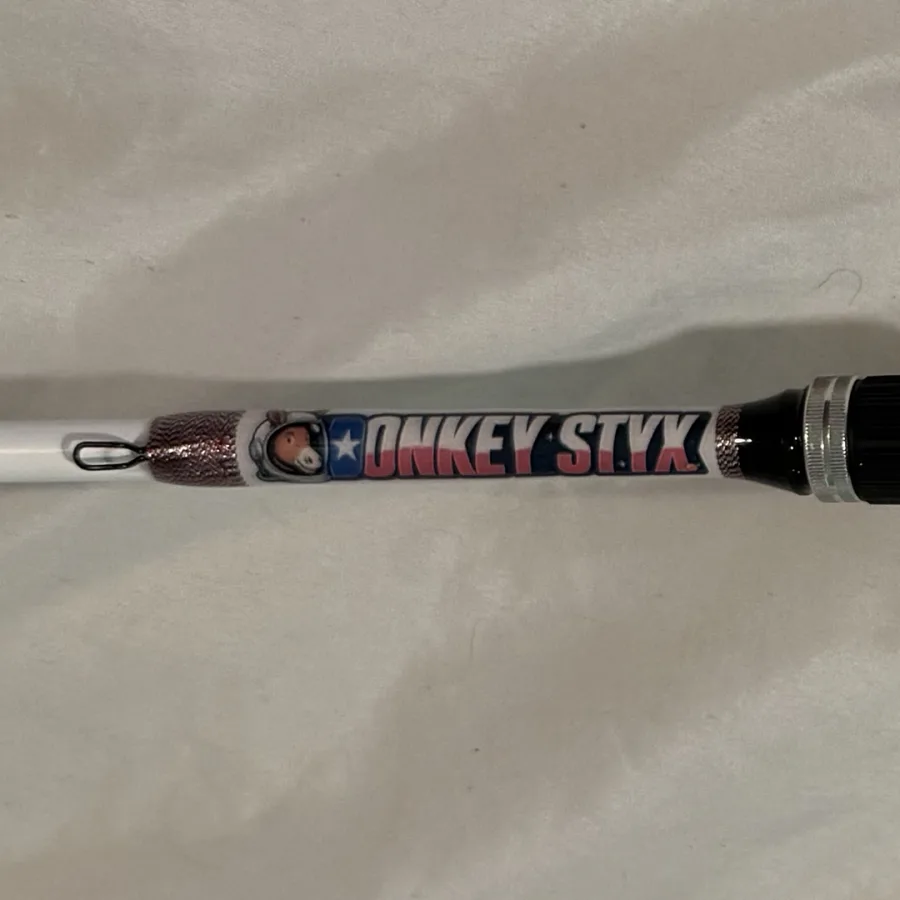 Donkey Styx rod, straight off the phone, dim and on a wrinkled sheet